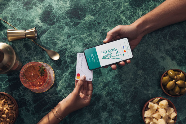 Customer tapping card to phone